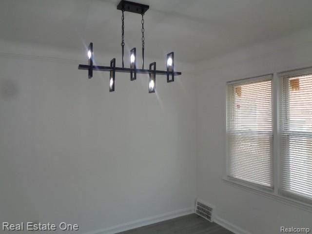 18259 Pinehurst St, Detroit, MI 48221 - empty room with baseboards and dark wood-style flooring