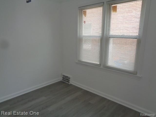 18259 Pinehurst St, Detroit, MI 48221 - empty room featuring baseboards and wood finished floors
