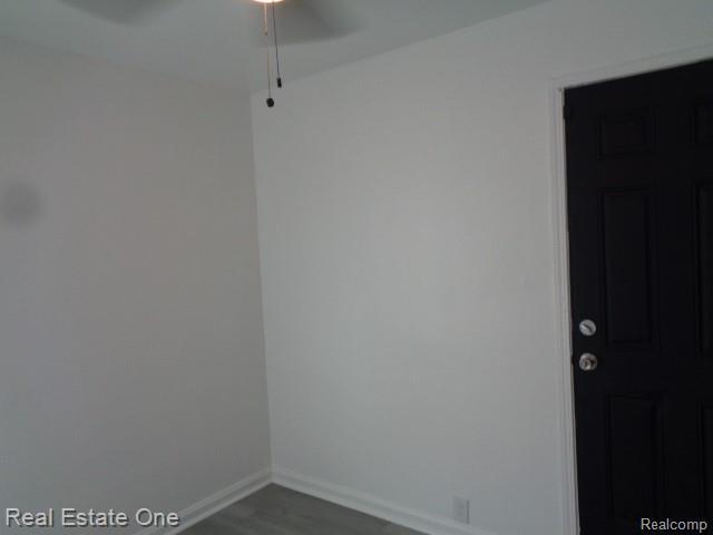 18259 Pinehurst St, Detroit, MI 48221 - spare room with a ceiling fan and wood finished floors