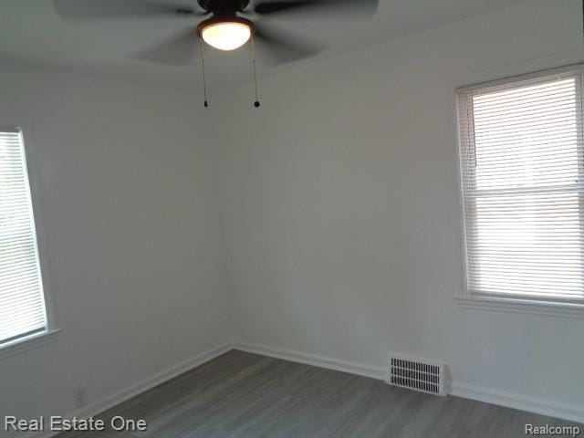 18259 Pinehurst St, Detroit, MI 48221 - unfurnished room featuring ceiling fan, wood finished floors, and healthy amount of natural light