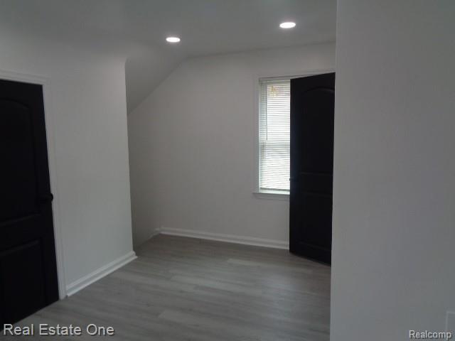 18259 Pinehurst St, Detroit, MI 48221 - bonus room with vaulted ceiling, wood finished floors, and recessed lighting