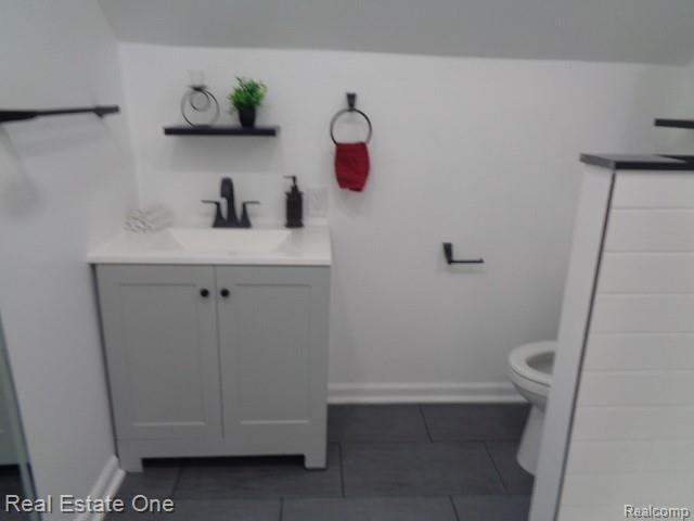 18259 Pinehurst St, Detroit, MI 48221 - bathroom featuring vanity and tile patterned floors