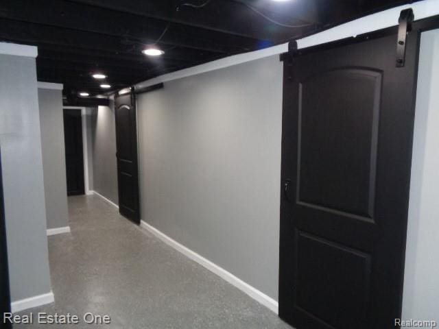 18259 Pinehurst St, Detroit, MI 48221 - hallway featuring a barn door and baseboards
