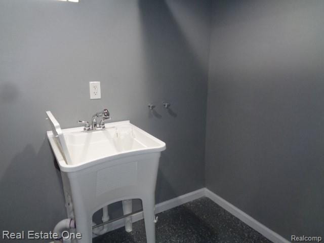 18259 Pinehurst St, Detroit, MI 48221 - bathroom with a sink and baseboards
