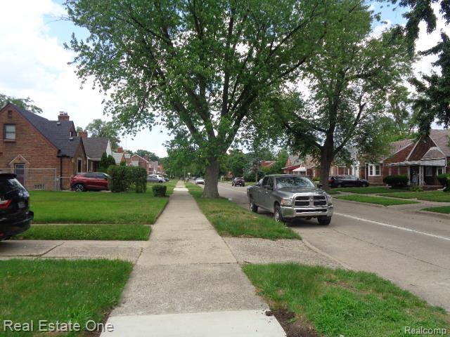 18259 Pinehurst St, Detroit, MI 48221 - view of concrete road with sidewalks and a residential view