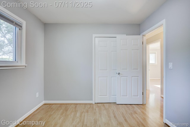 2416 Bonner St, Ferndale, MI 48220 - unfurnished bedroom with wood finished floors and a closet
