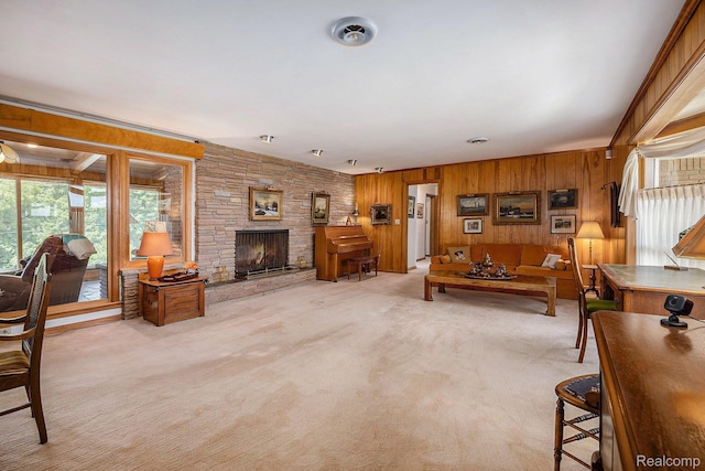 6400 N Rochester Rd, Rochester Hills, MI 48306 - living room featuring wooden walls, light colored carpet, and a stone fireplace