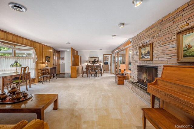 6400 N Rochester Rd, Rochester Hills, MI 48306 - living area with a stone fireplace and wooden walls