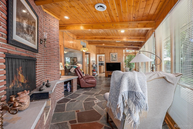 6400 N Rochester Rd, Rochester Hills, MI 48306 - living area with stone floors, an outdoor brick fireplace, wooden walls, and a wooden ceiling with exposed beams