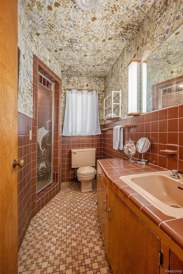 6400 N Rochester Rd, Rochester Hills, MI 48306 - bathroom featuring tile walls, vanity, and a shower stall