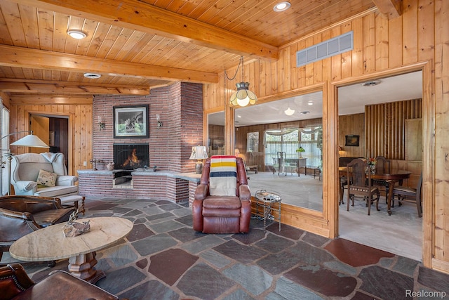 6400 N Rochester Rd, Rochester Hills, MI 48306 - living room featuring wood walls, a brick fireplace, stone flooring, a wood ceiling with exposed beams, and recessed lighting