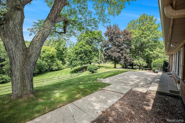 6400 N Rochester Rd, Rochester Hills, MI 48306 - view of yard featuring a patio and view of scattered trees