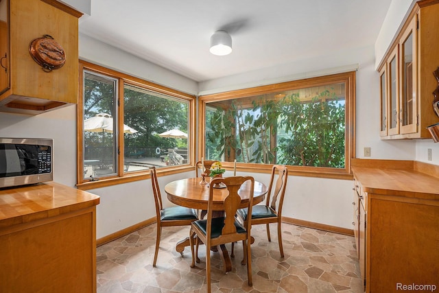 6400 N Rochester Rd, Rochester Hills, MI 48306 - dining space featuring baseboards