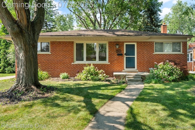 17022 Marguerite St, Beverly Hills, MI 48025 - view of front of house featuring a chimney, brick siding, and a front yard