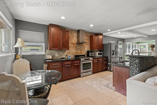 17022 Marguerite St, Beverly Hills, MI 48025 - kitchen with appliances with stainless steel finishes, wall chimney range hood, dark countertops, decorative backsplash, and recessed lighting
