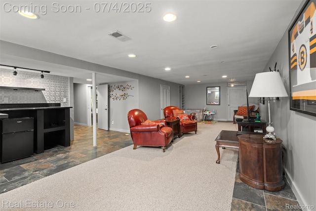 17022 Marguerite St, Beverly Hills, MI 48025 - living room featuring dark stone finish floors and recessed lighting