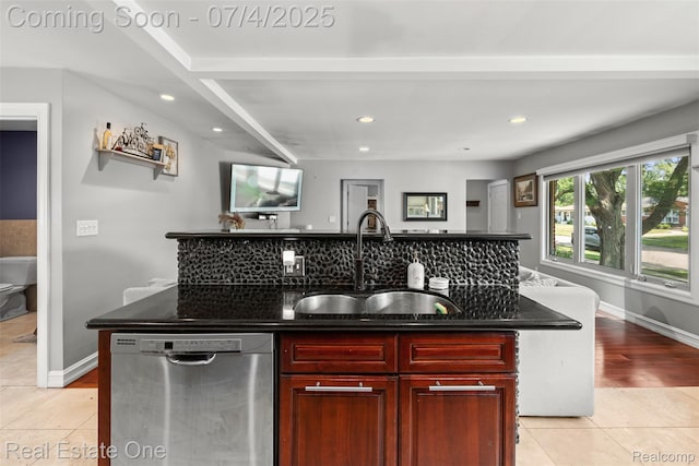 17022 Marguerite St, Beverly Hills, MI 48025 - kitchen with stainless steel dishwasher, dark brown cabinets, light tile patterned floors, recessed lighting, and an island with sink