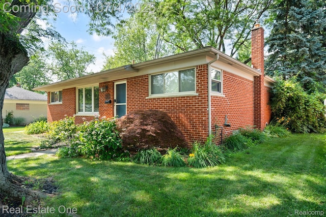 17022 Marguerite St, Beverly Hills, MI 48025 - single story home with a chimney, brick siding, and a front lawn