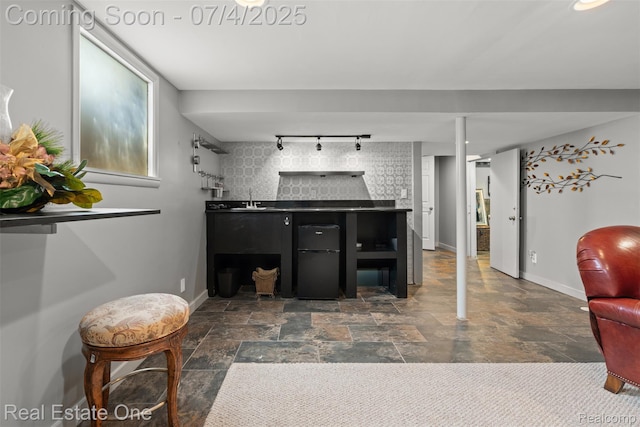 17022 Marguerite St, Beverly Hills, MI 48025 - bathroom featuring rail lighting and stone finish flooring