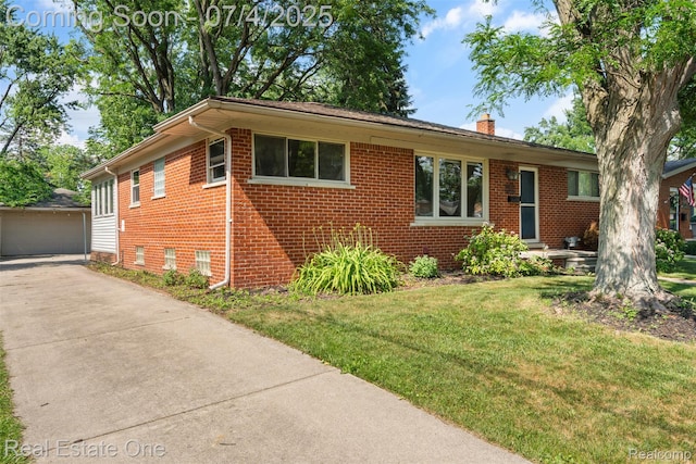 17022 Marguerite St, Beverly Hills, MI 48025 - view of front of home with a chimney, brick siding, a front yard, an outdoor structure, and a detached garage