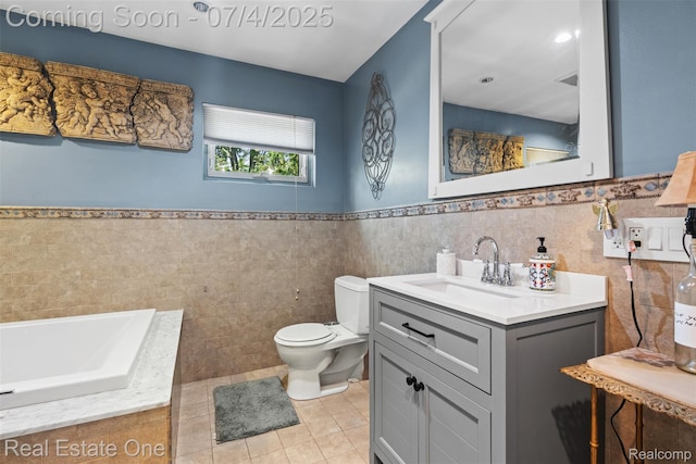 17022 Marguerite St, Beverly Hills, MI 48025 - full bathroom with tile walls, vanity, tile patterned floors, a garden tub, and wainscoting