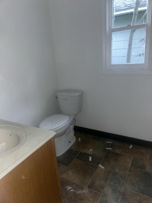 1615 Dyson St, Muskegon, MI 49442 - half bathroom featuring vanity and stone tile flooring