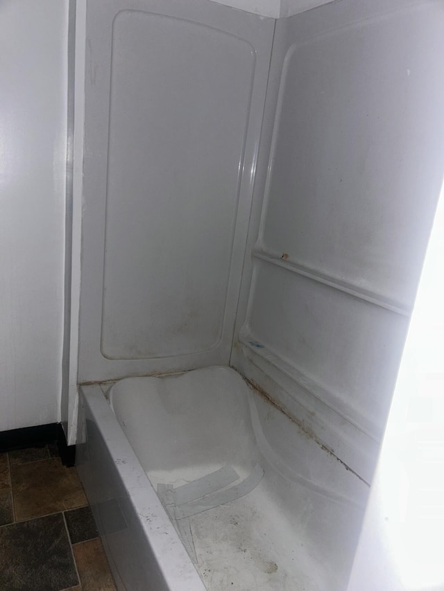 1615 Dyson St, Muskegon, MI 49442 - bathroom with a bath, stone finish flooring, and a shower