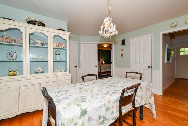 50983 Kiawah Trl, Mattawan, MI 49071 - dining space featuring a chandelier, wainscoting, and light wood finished floors