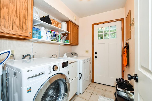 50983 Kiawah Trl, Mattawan, MI 49071 - laundry room with cabinet space, washer and clothes dryer, and light tile patterned flooring