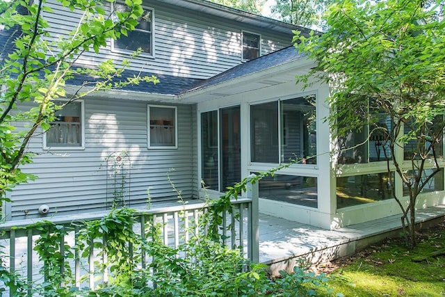 50983 Kiawah Trl, Mattawan, MI 49071 - view of side of home featuring a shingled roof and a sunroom