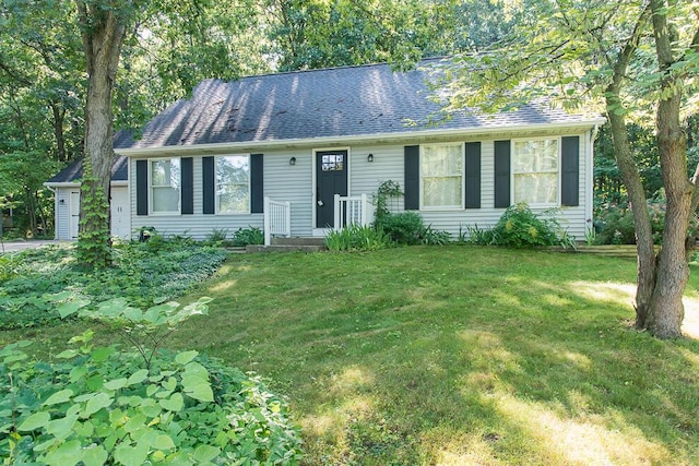 50983 Kiawah Trl, Mattawan, MI 49071 - view of front of house with a front yard and a shingled roof