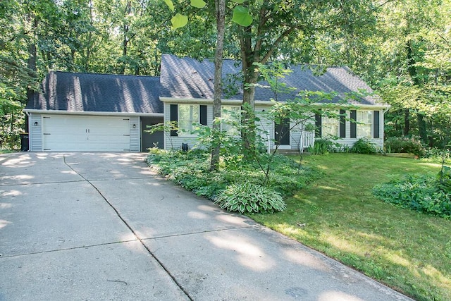 50983 Kiawah Trl, Mattawan, MI 49071 - view of front of home with driveway, a garage, a front yard, and a shingled roof