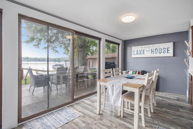 3265 Elmwood Beach Rd, Middleville, MI 49333 - dining room featuring a water view and wood finished floors