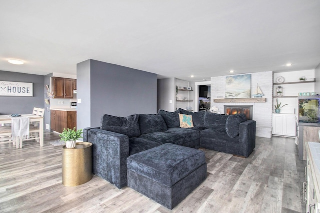 3265 Elmwood Beach Rd, Middleville, MI 49333 - living room with light wood finished floors and a fireplace