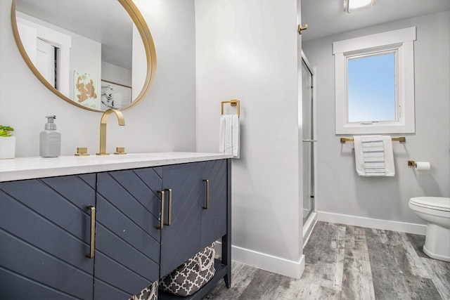 3265 Elmwood Beach Rd, Middleville, MI 49333 - full bathroom featuring wood finished floors, vanity, and a stall shower