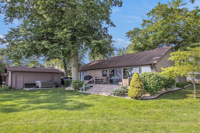 3265 Elmwood Beach Rd, Middleville, MI 49333 - back of house featuring a hot tub, a lawn, and a wooden deck