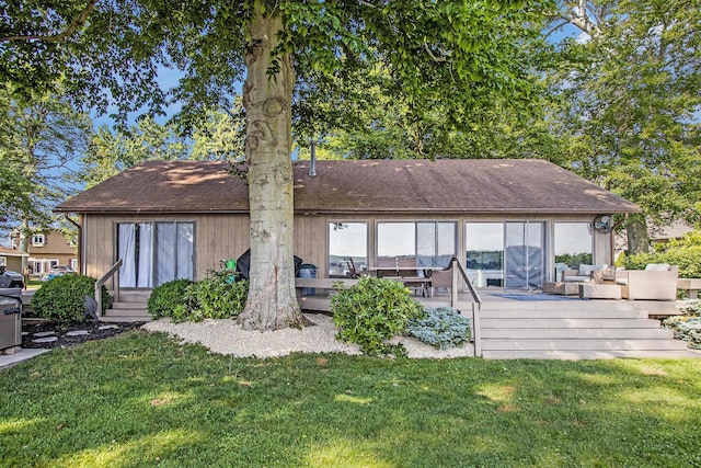 3265 Elmwood Beach Rd, Middleville, MI 49333 - rear view of property with a deck, a lawn, entry steps, and roof with shingles
