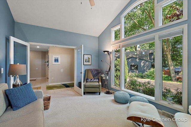 46 Counts Cove Ct, Holland, MI 49424 - sitting room with high vaulted ceiling, light colored carpet, ceiling fan, and light tile patterned floors