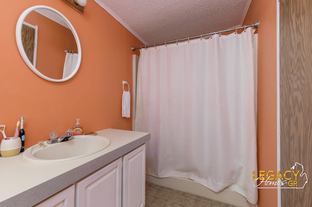 1163 Maple Leaf Ln NW, Walker, MI 49534 - bathroom with a textured ceiling, vanity, tile patterned floors, and shower / tub combo with curtain
