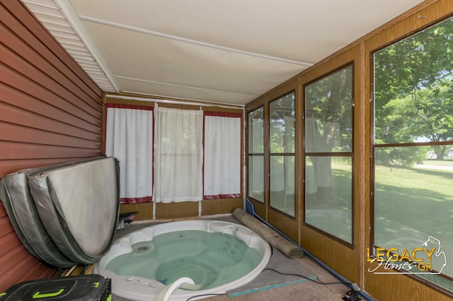 1163 Maple Leaf Ln NW, Walker, MI 49534 - sunroom featuring healthy amount of natural light and wood walls