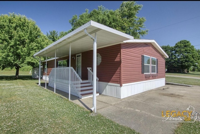 1163 Maple Leaf Ln NW, Walker, MI 49534 - view of property exterior featuring a yard, covered porch, and a carport