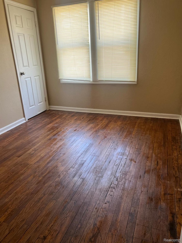 18995 Wormer St, Detroit, MI 48219 - spare room with dark wood-type flooring