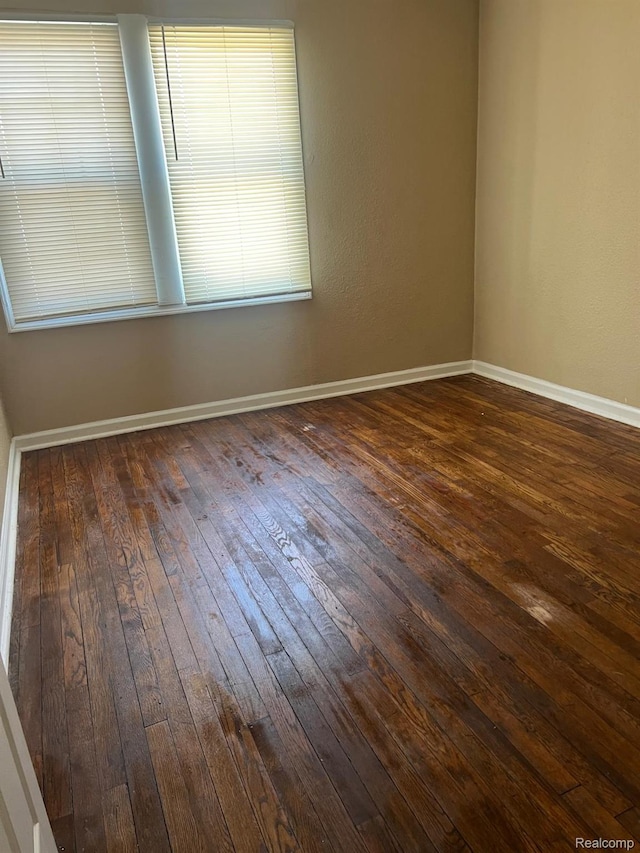 18995 Wormer St, Detroit, MI 48219 - unfurnished room featuring dark wood-type flooring and baseboards