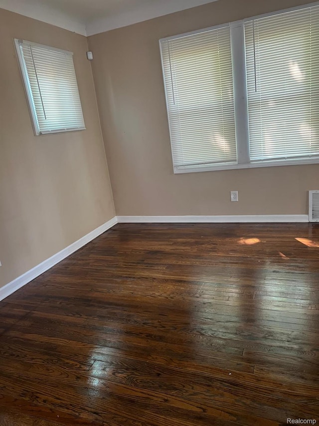 18995 Wormer St, Detroit, MI 48219 - spare room featuring dark wood-style flooring and baseboards