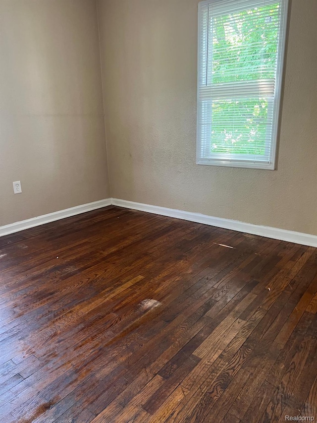 18995 Wormer St, Detroit, MI 48219 - empty room with dark wood-style flooring