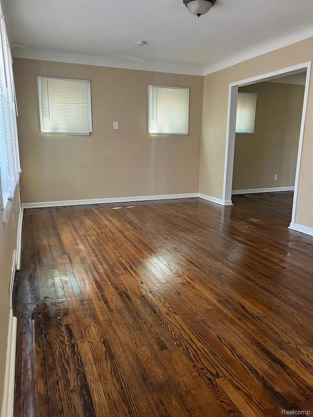 18995 Wormer St, Detroit, MI 48219 - spare room with dark wood-style floors and ornamental molding
