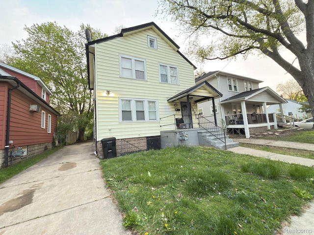 18995 Wormer St, Detroit, MI 48219 - traditional-style home with a porch, a wall mounted AC, and driveway