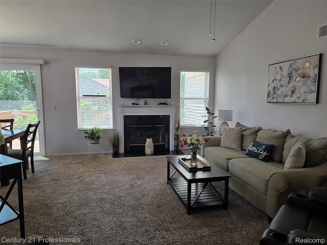 37329 Amhurst Dr Unit 23, Westland, MI 48185 - carpeted living room with plenty of natural light, a fireplace with flush hearth, and lofted ceiling