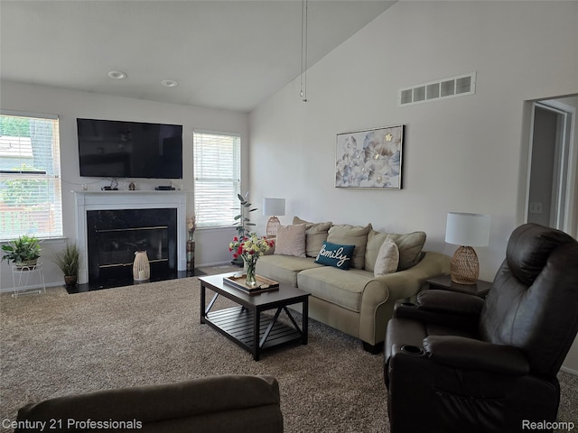 37329 Amhurst Dr Unit 23, Westland, MI 48185 - living room with healthy amount of natural light, a premium fireplace, high vaulted ceiling, and carpet floors