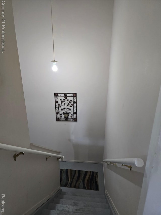 37329 Amhurst Dr Unit 23, Westland, MI 48185 - staircase featuring baseboards